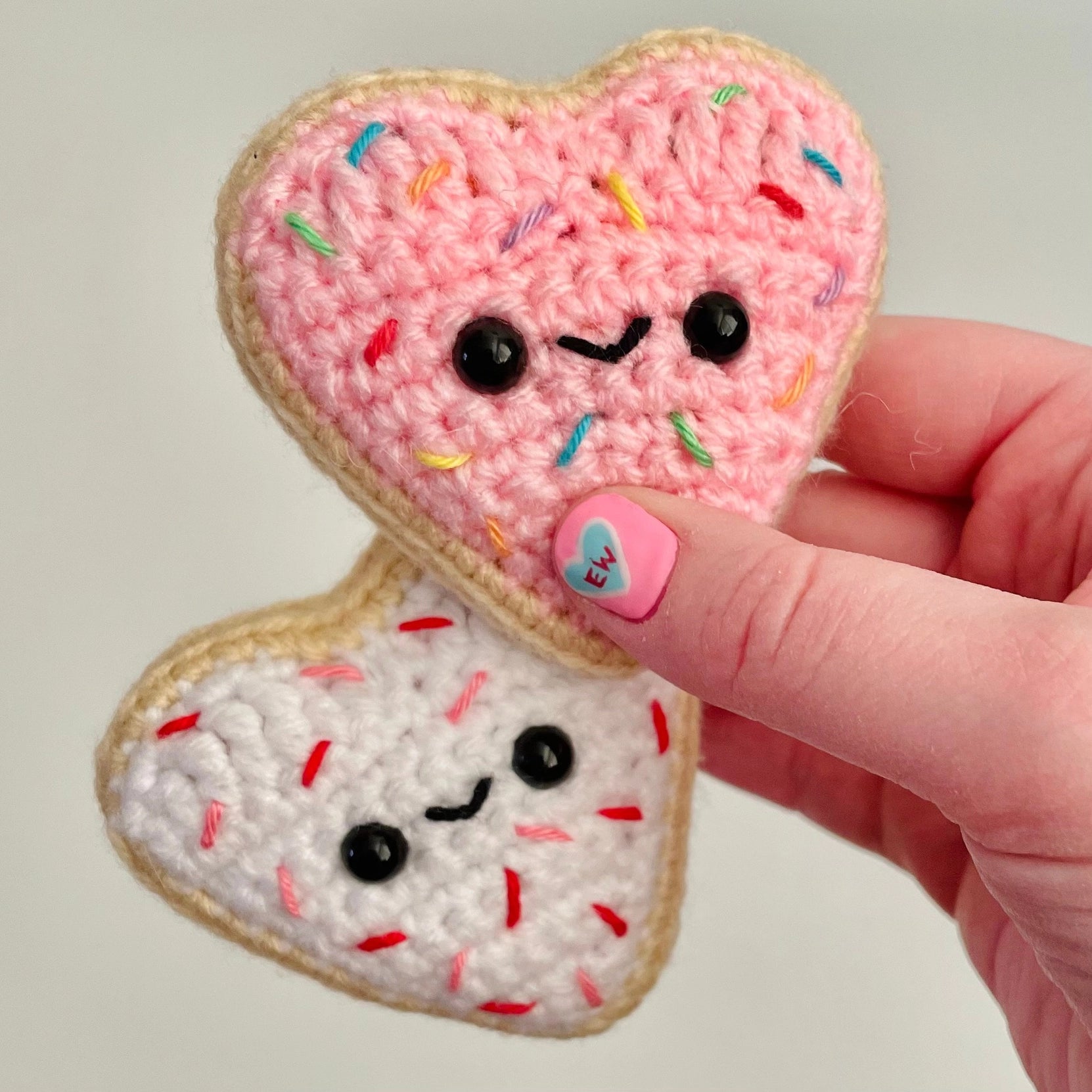 Indulge in sweetness with these Crocheted Heart-Shaped Sugar Cookies! Each cookie is lovingly crocheted with intricate detail, resembling the beloved classic treat.