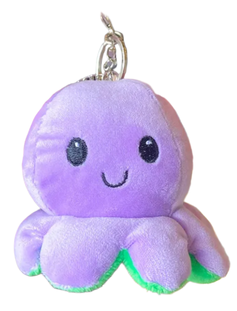 Smiling baby octopus attached to your keys and emanating delight. Try losing your keys with the Happy Octopus Reversible Plush Keychain attached, animated octopus plushie, purple, cutie