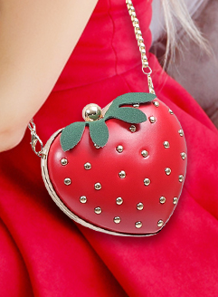 An amazing eye-catching fashion piece! Fall in love with this deliciously cute crossbody bag featuring a heart-shaped design that's perfect for kawaii fashion lovers! This charming accessory combines luxury and whimsy with its golden strawberry ball details and playful faux fur leaf accent.
