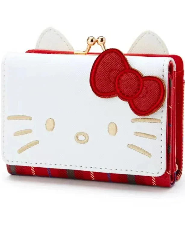 Plaid Print Wallet! Perfect for fans of the beloved Sanrio character, Hello Kitty, this wallet is as functional as it is cute.

Featuring Hello Kitty in a classy but fun red plaid design, the wallet is accented with a stylish gold clasp, giving it a chic, feminine look.

Made from durable synthetic leather, with multiple compartments for cards, cash, and coins.