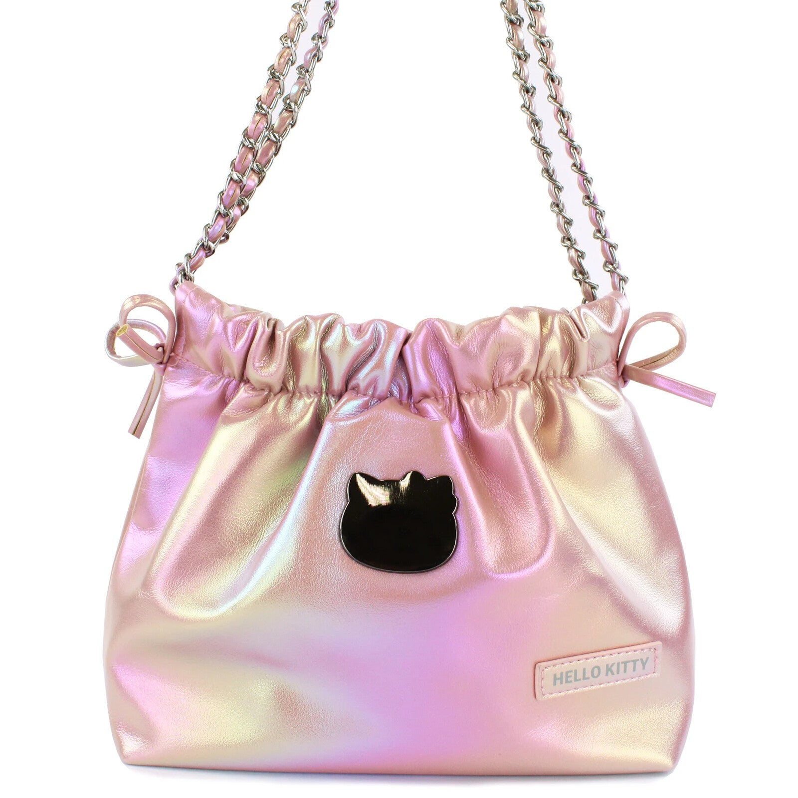 Class and shine meets everyday style with our Hello Kitty Pink Metallic Ribbon Shoulder Bag! This limited edition bag features a stunning silvery metallic finish that changes color at different angles, and is adorned with elegant ribbon details and an adorable Hello Kitty charm. The practical drawstring cinch closure keeps your belongings secure while maintaining easy access. Perfectly sized for daily essentials and featuring a comfortable shoulder strap, this bag combines functionality with kawaii flair. 