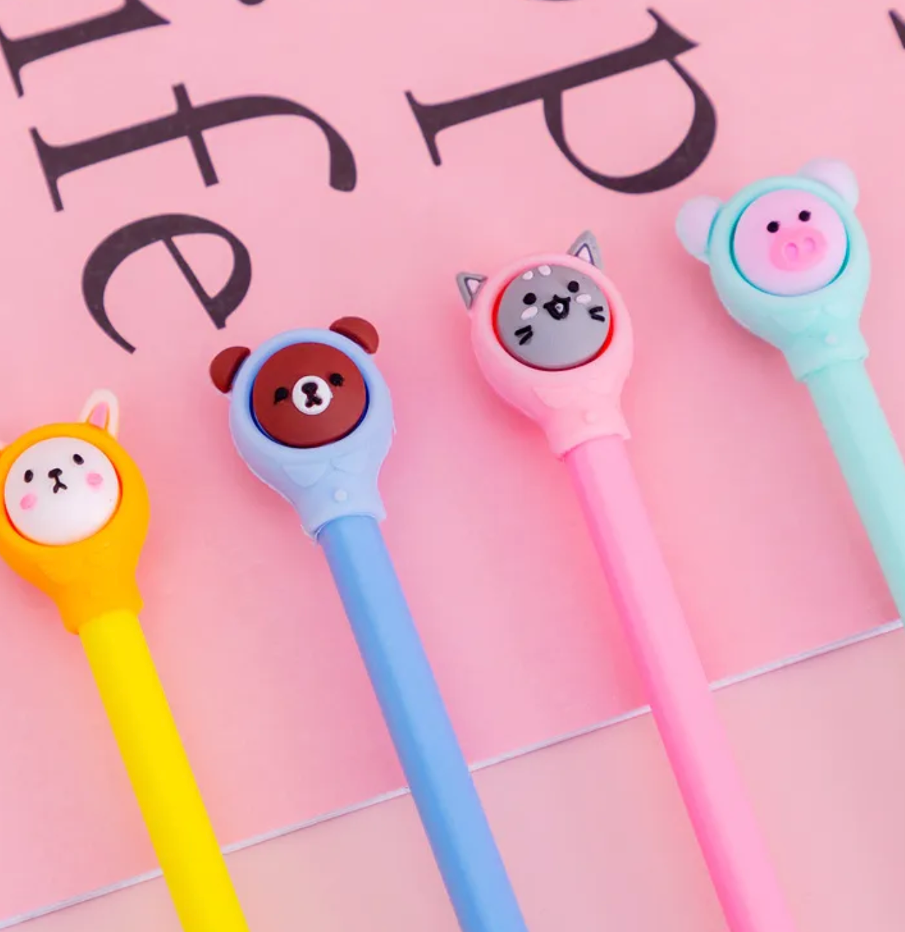 Hooded Animal Friends Gel Pen Set! This charming set features a delightful white bunny, a playful grey cat, a cuddly brown bear, and a sweet pink pig, all ready to bring a world of smiles to your stationery collection.