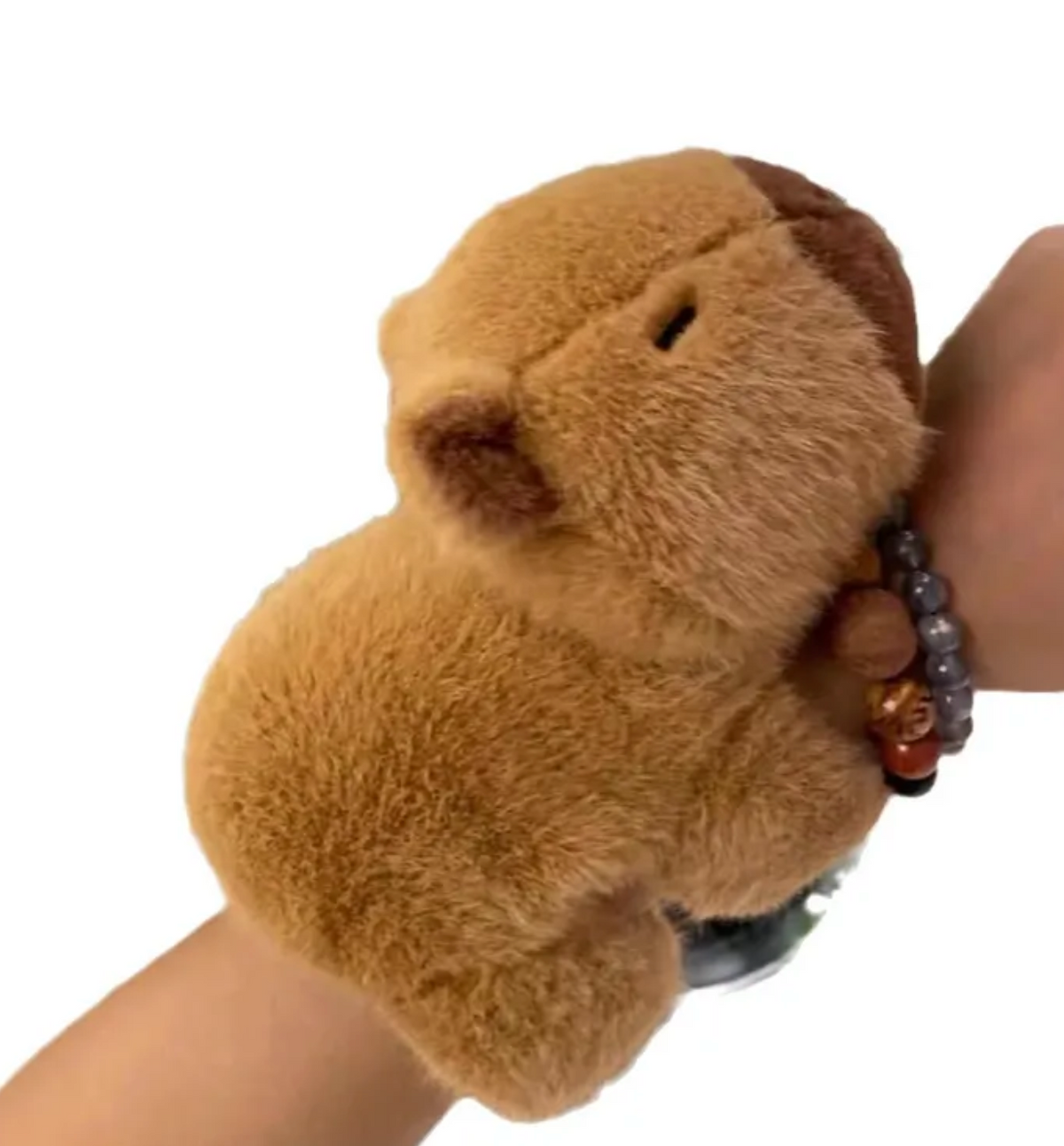 This captivating Capybara is the ultimate cuddle companion designed to bring warmth and comfort wherever you may be. Imagine a plushie that's always there for you and never wants to be left at home! It's loving, fleecy limbs double as wrist attachments that allow our furry friend to snuggle your arm on the go, while you get to wear the fuzziest and most faithful wrist accessory ever