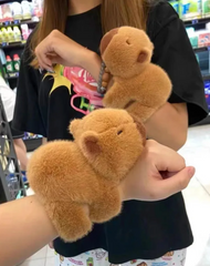 This captivating Capybara is the ultimate cuddle companion designed to bring warmth and comfort wherever you may be. Imagine a plushie that's always there for you and never wants to be left at home! It's loving, fleecy limbs double as wrist attachments that allow our furry friend to snuggle your arm on the go, while you get to wear the fuzziest and most faithful wrist accessory ever