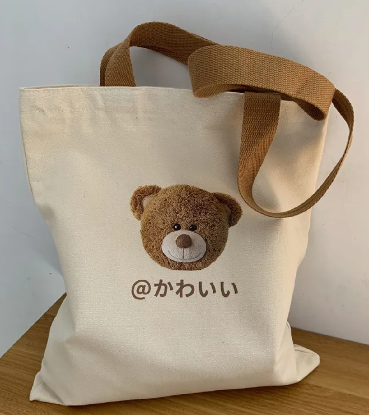 Our adorable street-style Japanese Kanji Cute Teddy Tote Bag is a versatile design that combines youthful style with practical functionality, making it a perfect companion for everyday use. kawaii 