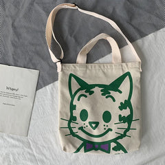 A fabulous mix of Japanese manga and American pop art styles, Japanese illustrator Osamu Harada created some of the most iconic kawaii designs of the 1980s. These Japanese Pop Art Cat Face Tote Bag by Osamu Goods feature his wholesome but edgy designs in a fabulous larger sized canvas tote with silkscreened happy cat face, one of his most famous iconic designs.