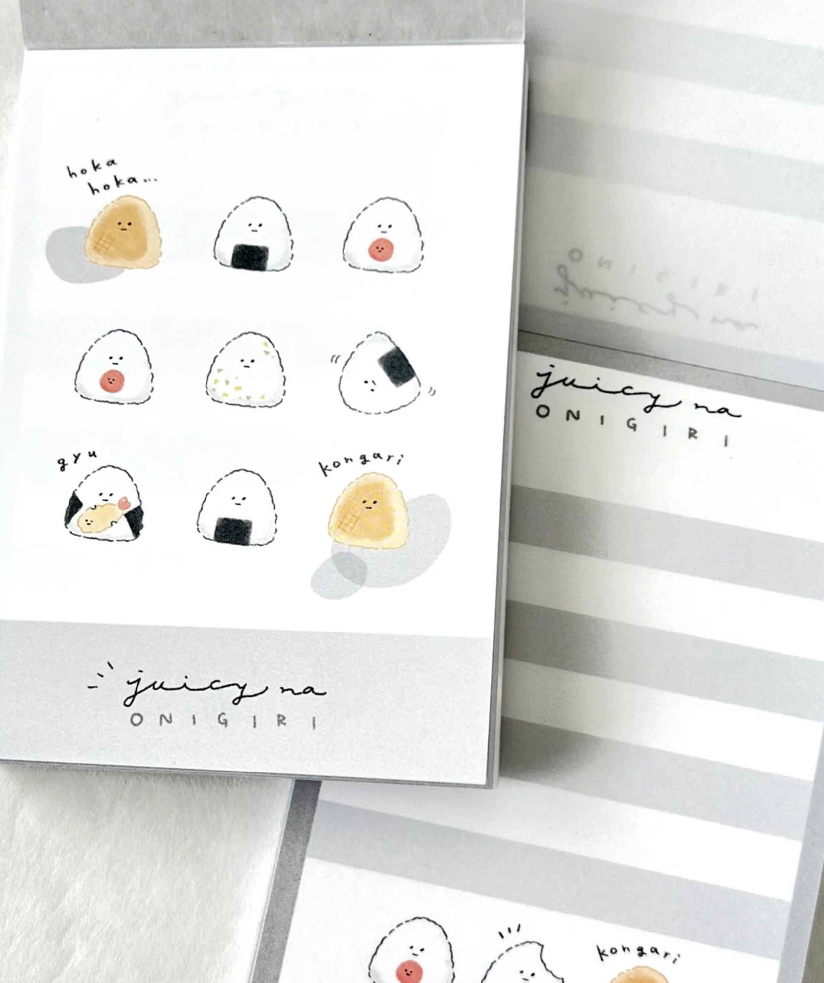 These Japanese Rice Balls 'Onigiri' Kawaii Mini Notepads feature two different designs, printed in full color. Quality binding, yet easy tear-out sheets.