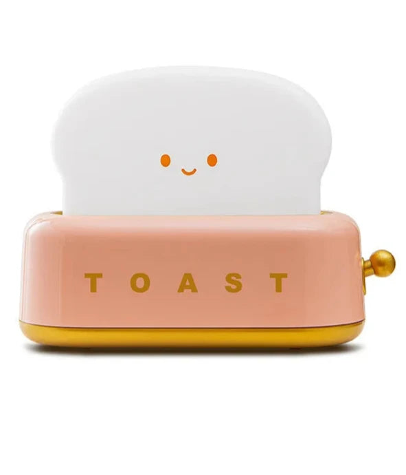 Brighten up your space with the Kawaii Design Toaster Table Lamp, a delightful and quirky decor piece for any room! Shaped like an adorable toaster, this lamp emits a warm, cozy glow from “toast slices." Its cute, playful design combines functionality with a touch of charm, perfect for adding a unique accent to desks, bedside tables, or cozy nooks.

Made with high-quality materials and LED lighting, it’s energy-efficient and easy on the eyes. A must-have for fans of all things carby and kawaii!