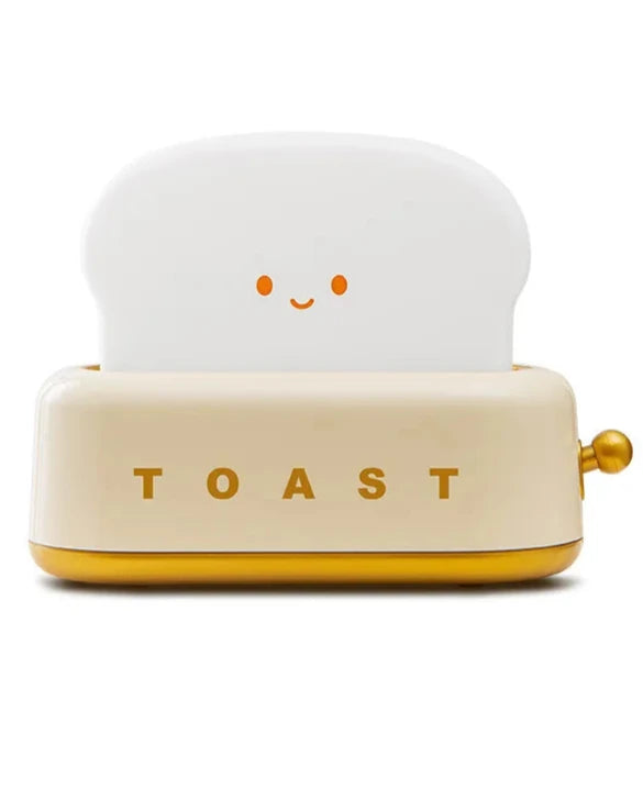 Brighten up your space with the Kawaii Design Toaster Table Lamp, a delightful and quirky decor piece for any room! Shaped like an adorable toaster, this lamp emits a warm, cozy glow from “toast slices." Its cute, playful design combines functionality with a touch of charm, perfect for adding a unique accent to desks, bedside tables, or cozy nooks.

Made with high-quality materials and LED lighting, it’s energy-efficient and easy on the eyes. A must-have for fans of all things carby and kawaii!