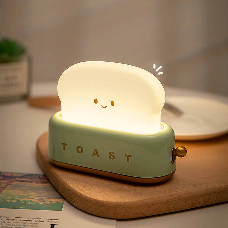 Brighten up your space with the Kawaii Design Toaster Table Lamp, a delightful and quirky decor piece for any room! Shaped like an adorable toaster, this lamp emits a warm, cozy glow from “toast slices." Its cute, playful design combines functionality with a touch of charm, perfect for adding a unique accent to desks, bedside tables, or cozy nooks.

Made with high-quality materials and LED lighting, it’s energy-efficient and easy on the eyes. A must-have for fans of all things carby and kawaii!