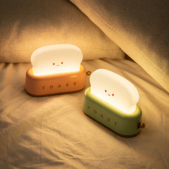 Brighten up your space with the Kawaii Design Toaster Table Lamp, a delightful and quirky decor piece for any room! Shaped like an adorable toaster, this lamp emits a warm, cozy glow from “toast slices." Its cute, playful design combines functionality with a touch of charm, perfect for adding a unique accent to desks, bedside tables, or cozy nooks.

Made with high-quality materials and LED lighting, it’s energy-efficient and easy on the eyes. A must-have for fans of all things carby and kawaii!