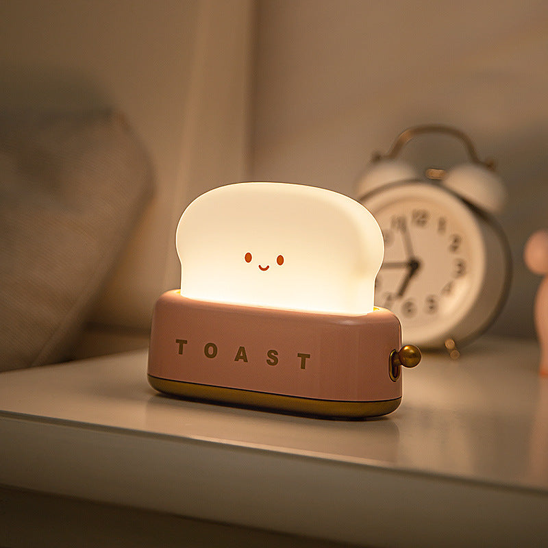 Brighten up your space with the Kawaii Design Toaster Table Lamp, a delightful and quirky decor piece for any room! Shaped like an adorable toaster, this lamp emits a warm, cozy glow from “toast slices." Its cute, playful design combines functionality with a touch of charm, perfect for adding a unique accent to desks, bedside tables, or cozy nooks.

Made with high-quality materials and LED lighting, it’s energy-efficient and easy on the eyes. A must-have for fans of all things carby and kawaii!