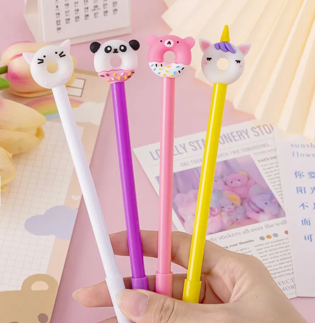 Our Kawaii Donut Animals Gel Pen Set includes four pens in various happy color palettes of white, purples, pinks, and yellow. These pens provide a smooth writing experience for those who like a gel ink tip.