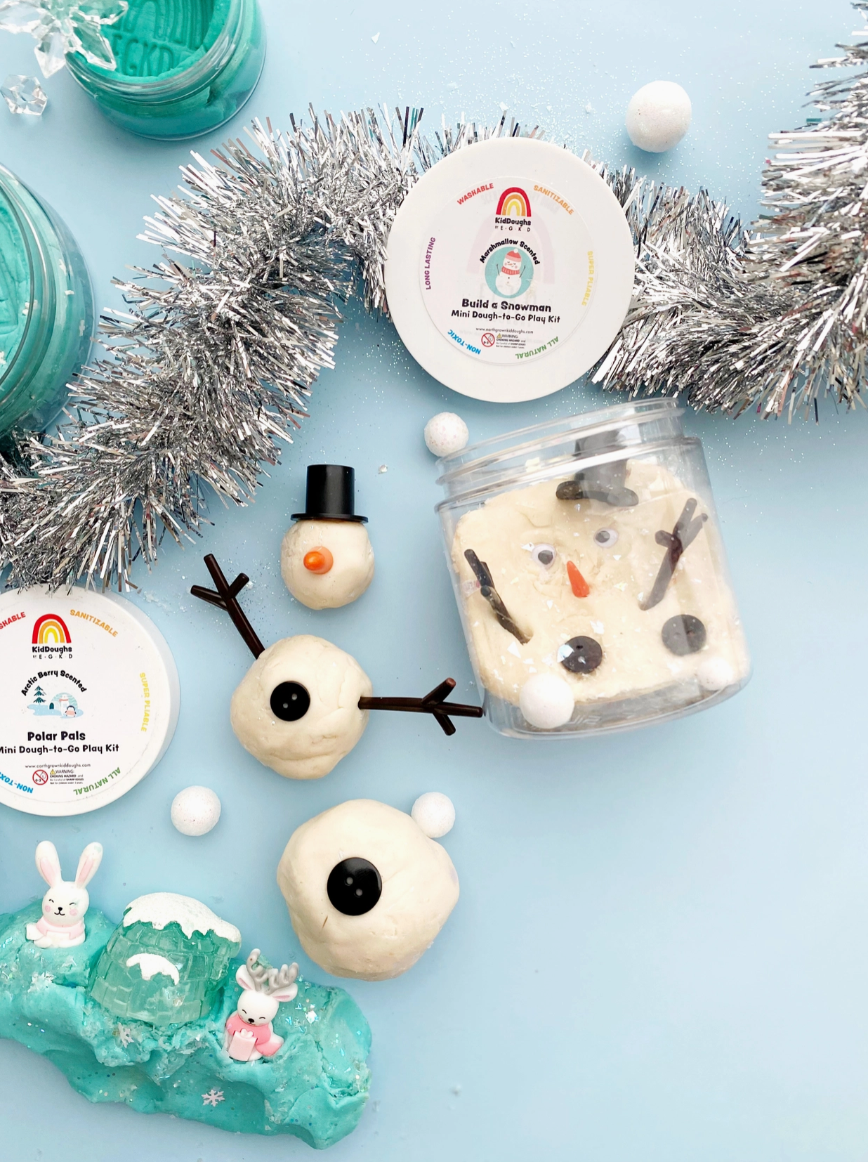 The Snowman Mini Dough-To-Go is the perfect winter-time dough activity! Marshmallow scented! Build a snowman and accessorize him with a carrot nose, arms, buttons, and a hat! Our sensory play kits are designed to inspire imagination and promote open-ended sensory play.