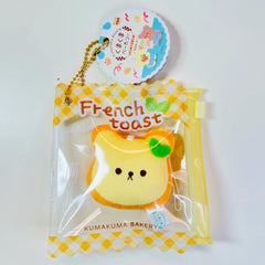 Say hello to the cutest little snack to carry your essentials! This unique Kuma Bakery Bear in a Bag Keychain, French Toast features a soft, squishy bread bear plushie tucked inside a charming clear and yellow checkered themed mini wallet. The softness is like a mochi dessert and the design is unmatched.