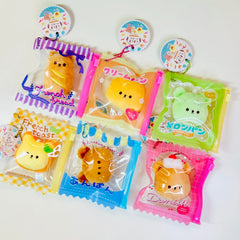 Say hello to the cutest little snack to carry your essentials! This unique Kuma Bakery Bear in a Bag Keychain features a soft, squishy bread bear plushie tucked inside a charming see-through mini wallet. The softness is like a mochi dessert and the design is unmatched.