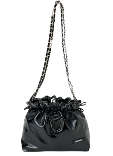 Edge, class and shine meets everyday style with our Kuromi Black Metallic Ribbon Shoulder Bag! This limited edition bag features a stunning black metallic finish that and is adorned with elegant ribbon details and an adorable Kuromi charm. The practical drawstring cinch closure keeps your belongings secure while maintaining easy access. Perfectly sized for daily essentials and featuring a comfortable shoulder strap, this bag combines functionality with kawaii flair.  