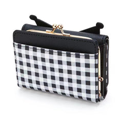 Add a touch of adorable charm to your daily essentials with this Kuromi Face Black Gingham Print Wallet! Perfect for fans of the beloved Sanrio character, Kuromi, this wallet is as functional as it is cute.

Featuring Kuromi in a classy but fun black gingham design, the wallet is accented with a stylish gold clasp, giving it a chic, feminine look.

Made from durable synthetic leather, with multiple compartments for cards, cash, and coins.