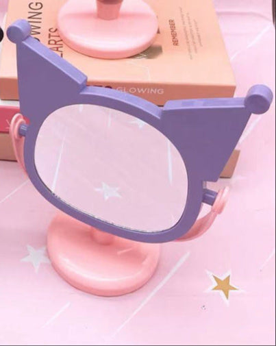 Mirror, mirror, with Kuromi flair - who's the most kawaii of them all? You are, of course! Especially with this absolutely adorable Kuromi Face Rotating Vanity Mirror by your side!

This two-sided beauty essential features our favorite rebel princess Kuromi in a pink and purple design that'll make your vanity space totally social-media-worthy. One side offers regular reflection for your everyday glam, while the other features My Melody's face.