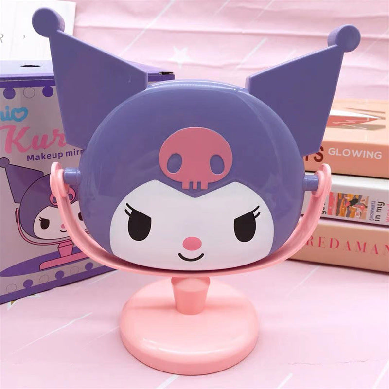 Mirror, mirror, with Kuromi flair - who's the most kawaii of them all? You are, of course! Especially with this absolutely adorable Kuromi Face Rotating Vanity Mirror by your side!

This two-sided beauty essential features our favorite rebel princess Kuromi in a pink and purple design that'll make your vanity space totally social-media-worthy. One side offers regular reflection for your everyday glam, while the other features My Melody's face.