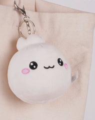 Discover the charm of our Lil Dumpling Bao Plush Keychain, a delightful and versatile accessory. This adorable plushie, designed to look like a cute, fluffy bao dumpling, features a removable keychain.

Use it as a quirky keychain, a charming bag accessory, or simply as a cuddly mini plushie. Its soft fabric and charming design make it perfect for food enthusiasts and fans of cute collectibles alike, offering three ways to bring a touch of joy to your daily routine.