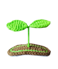 Show off your growing little sprout with this Lil' Sprout Handmade Crocheted Hair Clip! An absolutely adorable accessory for littles and fun loving young-at-hearts, this cotton crocheted clip secures at the very top of the head to give the most heart warming crush to everyone who lays eyes on it- two little green sprouts peep out over a garden bed of dirt.