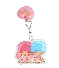 Add a sprinkle of celestial charm to your belongings with the Little Twin Stars Retro Puff Keychain. Featuring the beloved duo, Kiki and Lala, this adorable keychain brings a touch of magic and whimsy wherever you go. Perfect for keys, bags, or backpacks, it's a delightful accessory for any Sanrio fan.