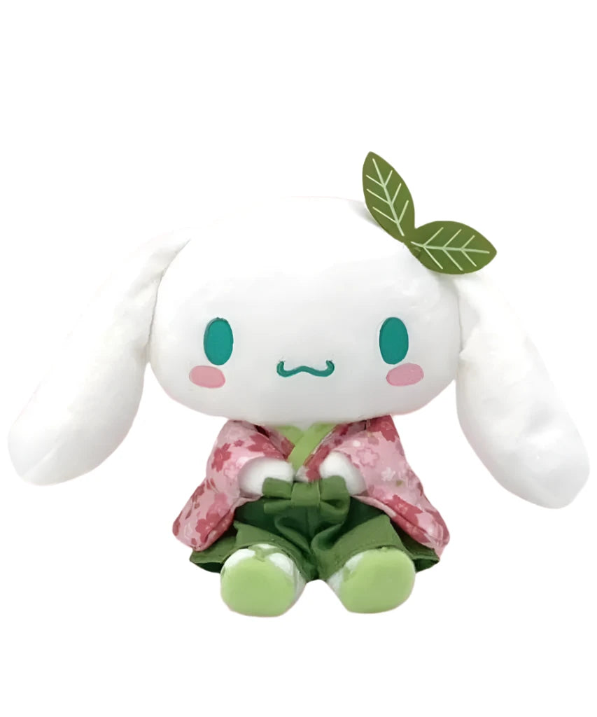 Suppose you miss the beauty of spring and the lovely fragrance of cherry blossoms. Have it forever with the Matcha Sakura Garden Cinnamoroll Kimono Plushie, an enchanting mix of traditional Japanese elegance and kawaii charm. This plushie is made from soft, huggable material, perfect for snuggling or adding a cute touch to your space.

Cinnamoroll's gentle expression and detailed kimono design make his charm as lovely as the spring flower. The vibrant green color and delicate sakura motifs give him a unique