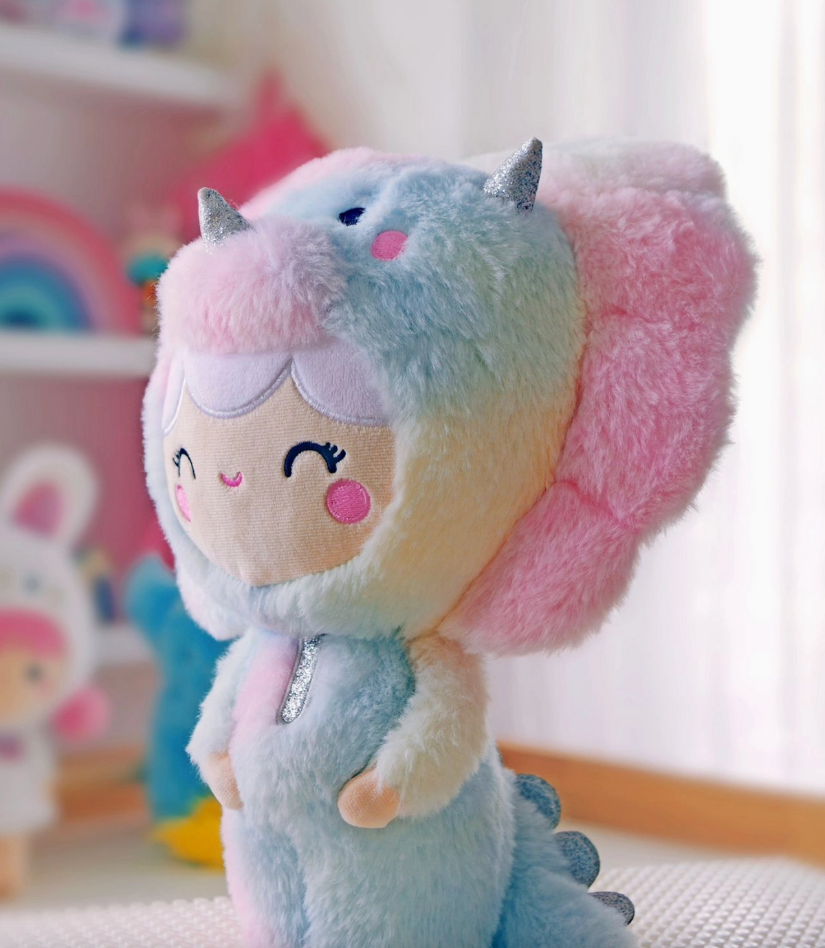 She’s dino-mighty! Each Momiji Roarsome Rainbow Dinosaur Plushie is unique. Her pastel rainbow pattern is positioned differently on each dinosaur, so there’ll never be another exactly like yours anywhere in the world.  Featuring super soft plush fabric and embroidered details. &nbsp;Soft, huggable, iconic characters.&nbsp;