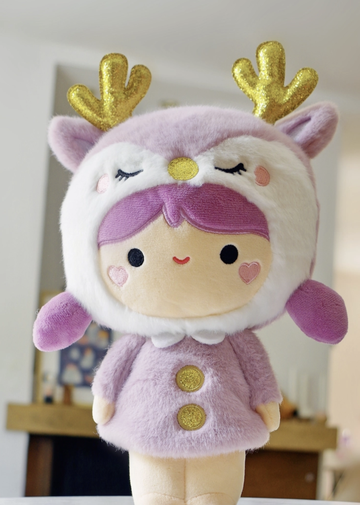 A special piece designed for collectors, plush enthusiasts, and those seeking a unique gift that stands the test of time. Soft lavender plush and sparkly antlers give this Momiji Twinkle Plum Girl Plushie strong woodland creature vibes.