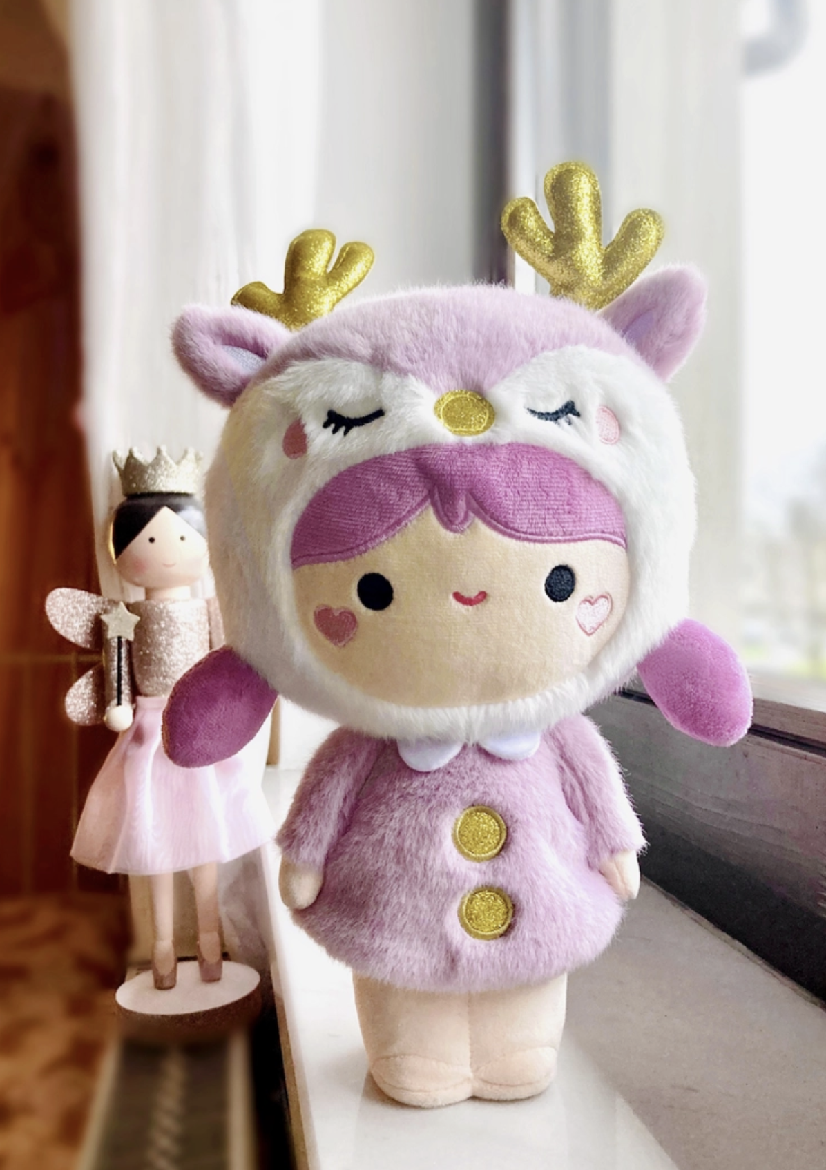 A special piece designed for collectors, plush enthusiasts, and those seeking a unique gift that stands the test of time. Soft lavender plush and sparkly antlers give this Momiji Twinkle Plum Girl Plushie strong woodland creature vibes.