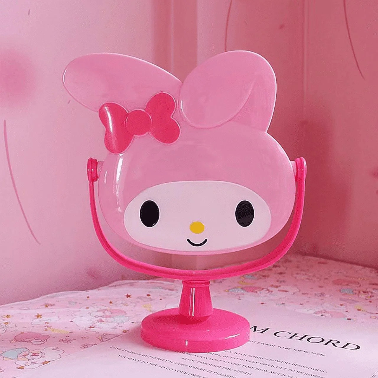 This My Melody Rotating Vanity Mirror, features the beloved Sanrio character, in a perfect blend of cute and functional, making your beauty routine even more delightful. Adorned with My Melody’s iconic ears and bow, this mirror adds a cute flair to your space.