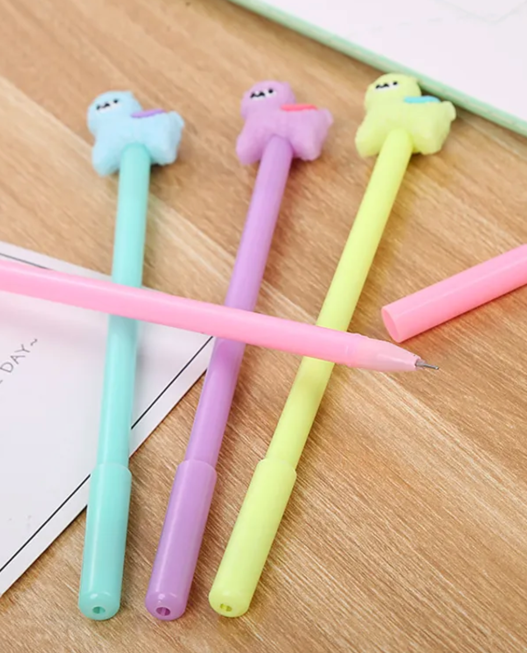 For llama and alpaca fans alike, our No Drama Llama Gel Pen Set includes four pens in various bright pastels of yellow, pink, purple, and blue. These pens provide a smooth writing experience for those who like a gel ink tip.