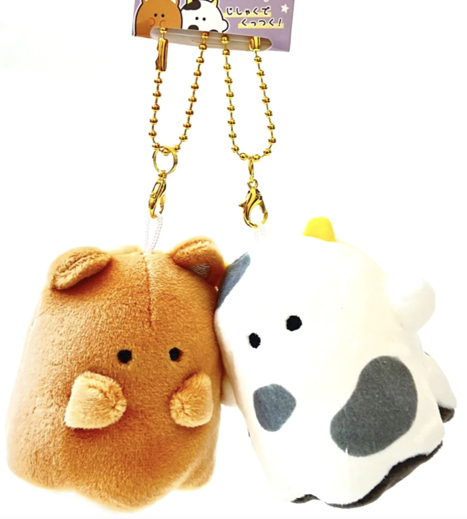 Meet your new companion from Obakane Farm - the Ghost Buddy Magnetic Plush Keychain! This whimsical keychain features a friendly ghost design that's both cute and spooky. With its magnetic hands, it easily attaches to any metallic surface, making it perfect for adding a playful touch to your keys, bag, or fridge.