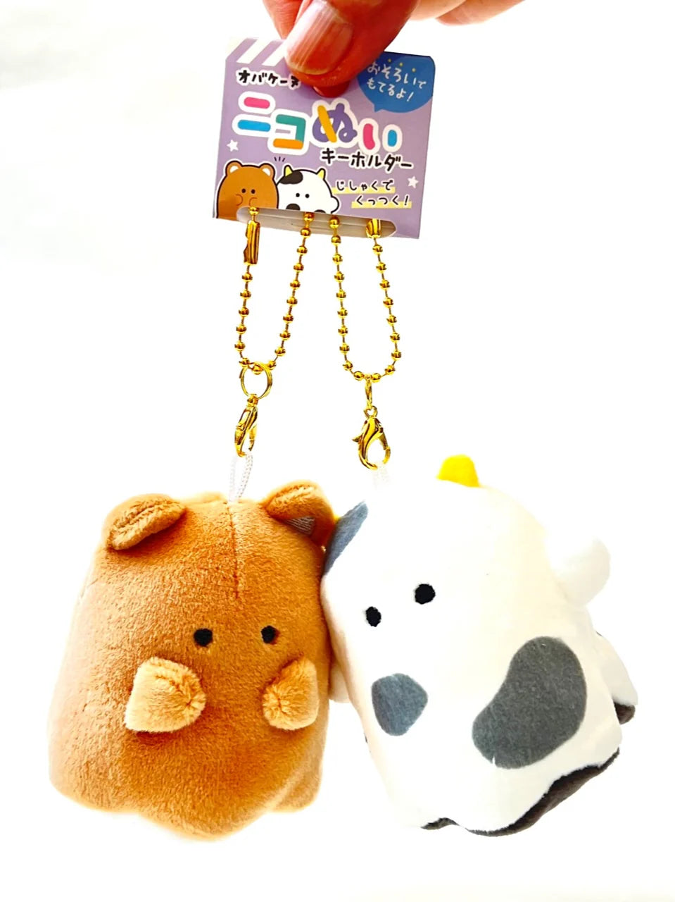 Meet your new companion from Obakane Farm - the Ghost Buddy Magnetic Plush Keychain! This whimsical keychain features a friendly ghost design that's both cute and spooky. With its magnetic hands, it easily attaches to any metallic surface, making it perfect for adding a playful touch to your keys, bag, or fridge.

Crafted with soft, plush materials, it's as huggable as it is charming. Whether you're a fan of the paranormal or simply love unique accessories, this Ghost Buddy is ready to haunt your everyday.