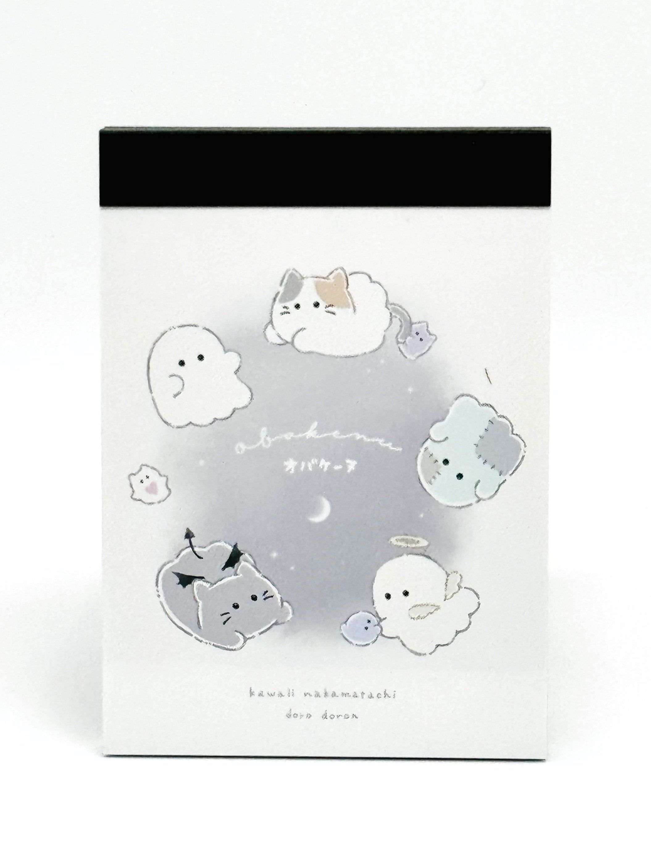 Obakane Ghost Stationary Set feature two notebooks with two different designs, printed in full color. Quality and chic holographic binding, yet easy tear-out sheets. A stand-up pencil sharpener featuring ghosts, cats, and dogs completes the set.