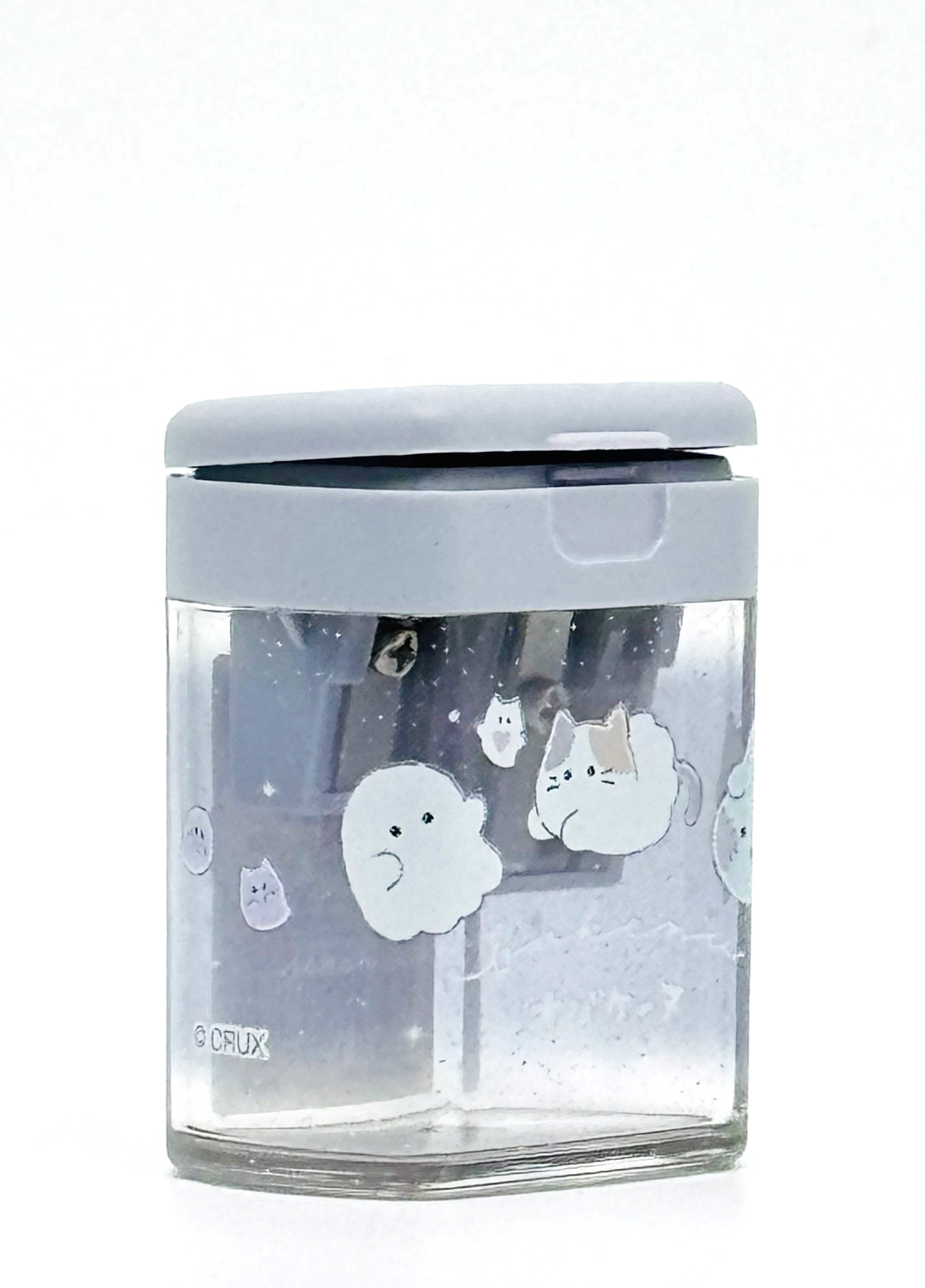 Obakane Ghost Stationary Set feature two notebooks with two different designs, printed in full color. Quality and chic holographic binding, yet easy tear-out sheets. A stand-up pencil sharpener featuring ghosts, cats, and dogs completes the set.