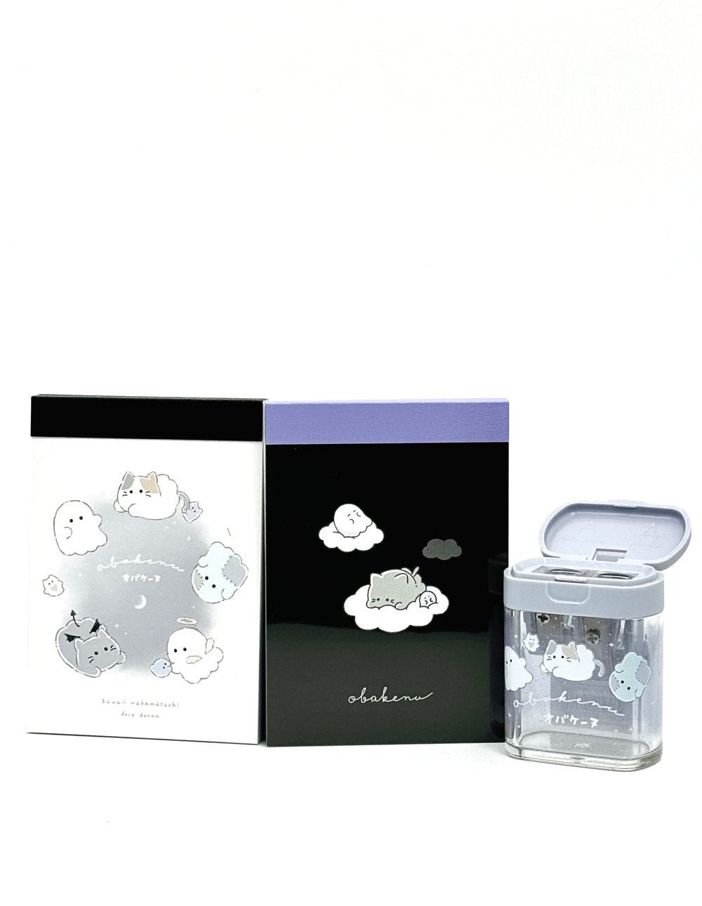 Obakane Ghost Stationary Set feature two notebooks with two different designs, printed in full color. Quality and chic holographic binding, yet easy tear-out sheets. A stand-up pencil sharpener featuring ghosts, cats, and dogs completes the set.