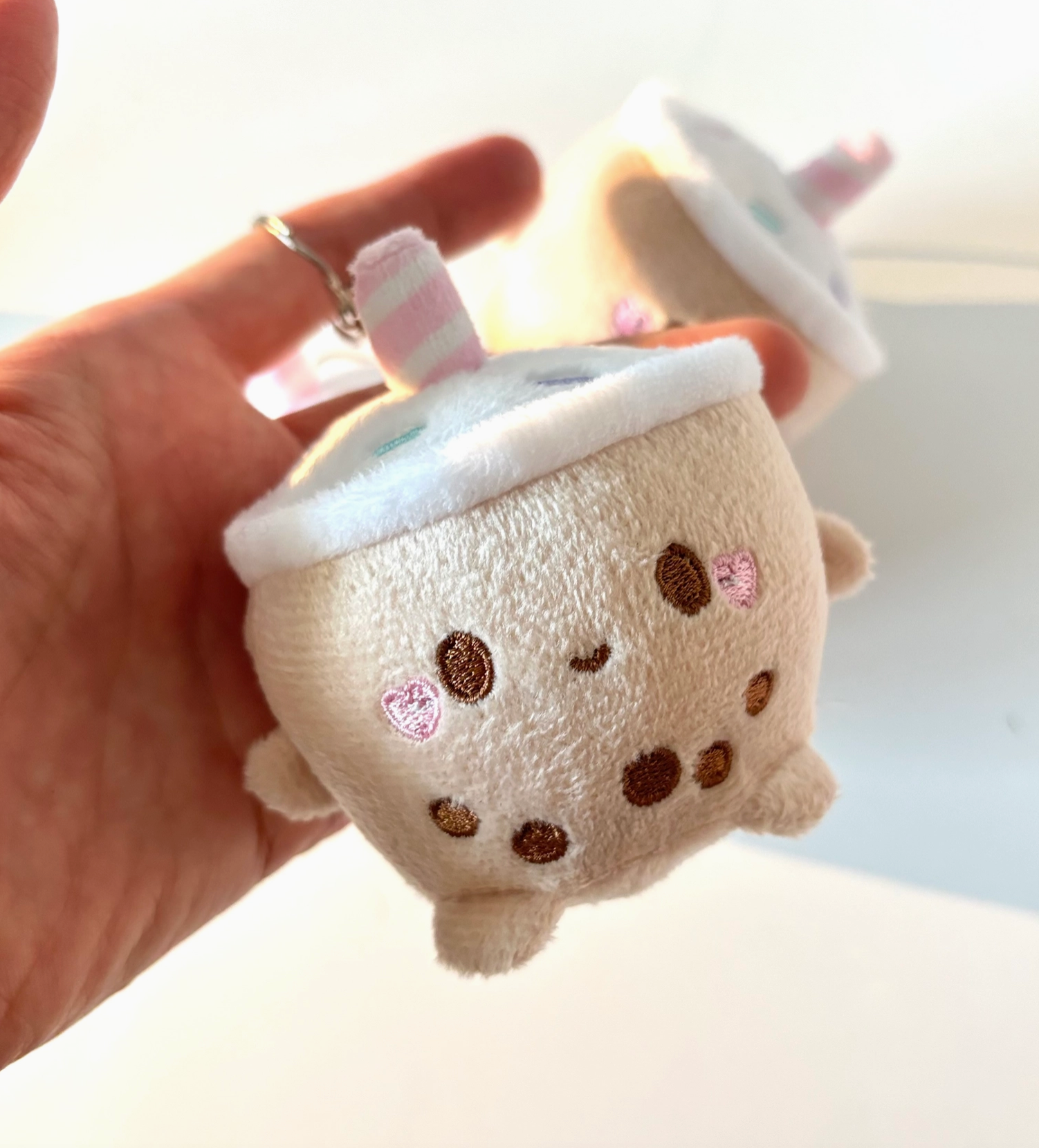 Say hello to the Mini Milky Plush Keychain, your new favorite chonky boba buddy! With its pastel candy sprinkles and sweet embroidery, this little guy is sure to add a burst of kawaii charm to your keys, bag, or backpack.