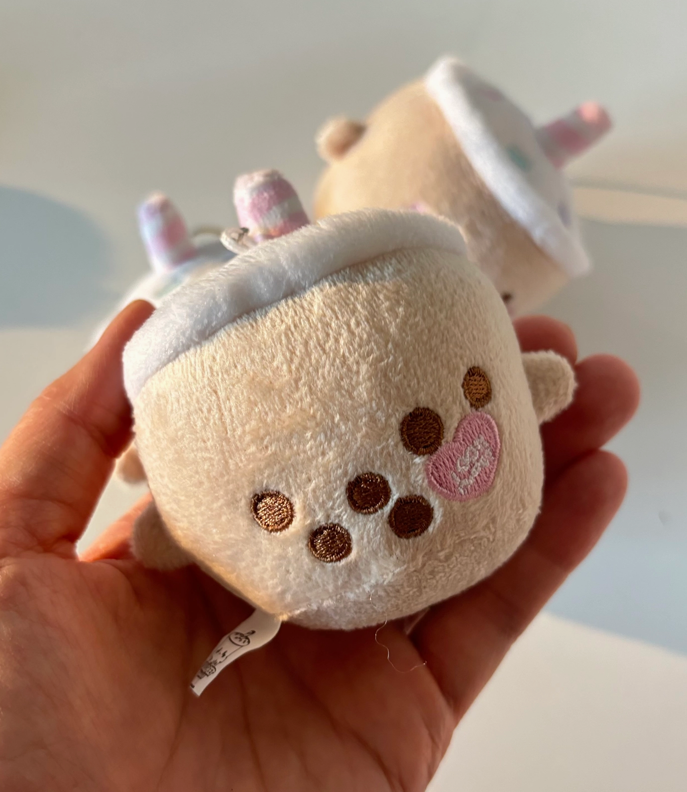 Say hello to the Mini Milky Plush Keychain, your new favorite chonky boba buddy! With its pastel candy sprinkles and sweet embroidery, this little guy is sure to add a burst of kawaii charm to your keys, bag, or backpack.