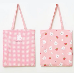 This Pink Gingham Bunny &amp; Strawberry Tote has major cottage-core vibes! This bag is ideal for all your on-the-go tasks and adds a charming kawaii touch to any outfit! Its spacious size makes it perfect for storing laptops, and everyday essentials, or doubling as a handy grocery bag.