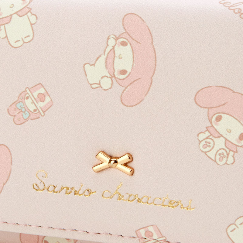 Add a touch of adorable charm to your daily essentials with this Pink My Melody Sanrio Gold Bow Wallet! Perfect for fans of the beloved Sanrio character, My Melody, this wallet is as functional as it is cute.

Featuring My Melody in a pastel pink design, the wallet is accented with a stylish gold bow and gold clasp, giving it a chic, feminine look.

Made from durable synthetic leather, with multiple compartments for cards, cash, and coins.