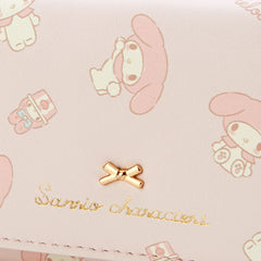 Add a touch of adorable charm to your daily essentials with this Pink My Melody Sanrio Gold Bow Wallet! Perfect for fans of the beloved Sanrio character, My Melody, this wallet is as functional as it is cute.

Featuring My Melody in a pastel pink design, the wallet is accented with a stylish gold bow and gold clasp, giving it a chic, feminine look.

Made from durable synthetic leather, with multiple compartments for cards, cash, and coins.