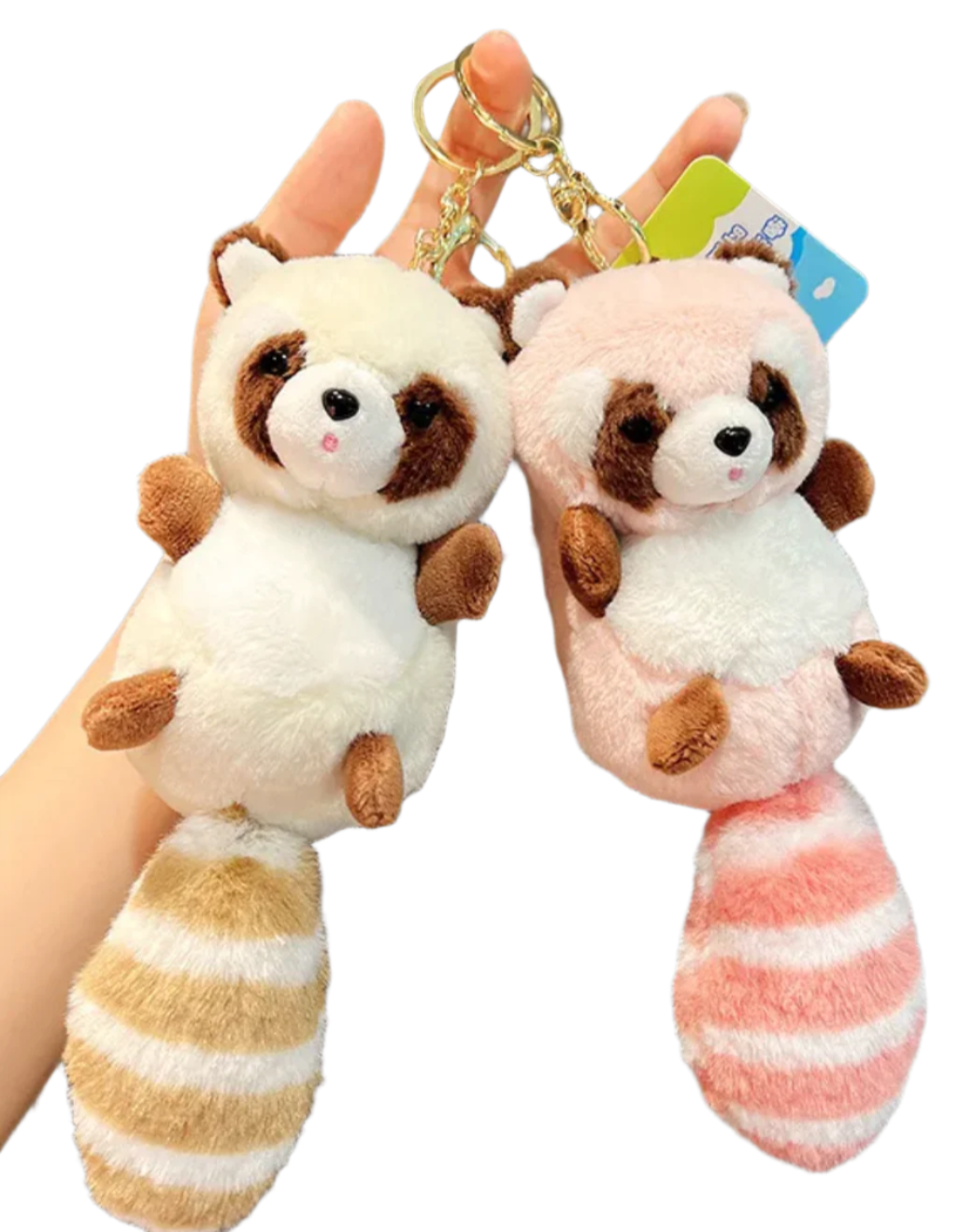 Discover charm and cuddliness with our adorable raccoon plushie keychain. Featuring a delightful pink hue and a light brown striped tail, this compact companion adds whimsy to your keys or backpack. Crafted with soft, high-quality materials, it's perfect for both kids and adults. Shop now and bring a touch of woodland magic wherever you go!