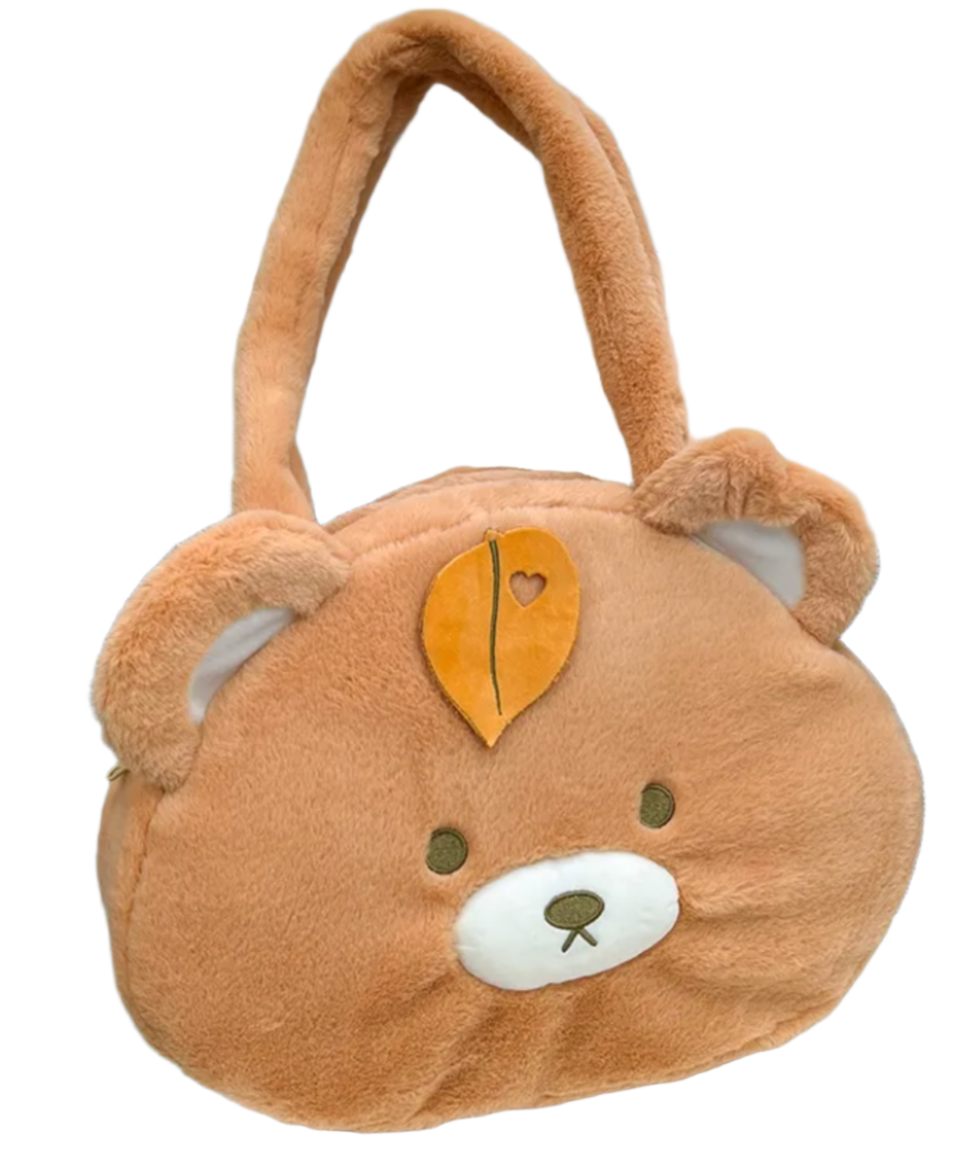 This Round Brown Bear Face Shoulder Bag brings the cute and functional Kawaii fashion. It features a charming brown bear head with embroidered face details and an adorable leaf upon its head, adding an even more playful touch to your look.  Made from soft, durable plush fabric that feels great to the touch, and a secure zipper closure to keep your belongings safe and easily accessible. Its interior is nice and spacious for all of your needs.