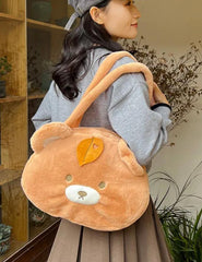 This Round Brown Bear Face Shoulder Bag brings the cute and functional Kawaii fashion. It features a charming brown bear head with embroidered face details and an adorable leaf upon its head, adding an even more playful touch to your look.  Made from soft, durable plush fabric that feels great to the touch, and a secure zipper closure to keep your belongings safe and easily accessible. Its interior is nice and spacious for all of your needs.