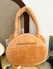 This Round Brown Bear Face Shoulder Bag brings the cute and functional Kawaii fashion. It features a charming brown bear head with embroidered face details and an adorable leaf upon its head, adding an even more playful touch to your look.  Made from soft, durable plush fabric that feels great to the touch, and a secure zipper closure to keep your belongings safe and easily accessible. Its interior is nice and spacious for all of your needs.