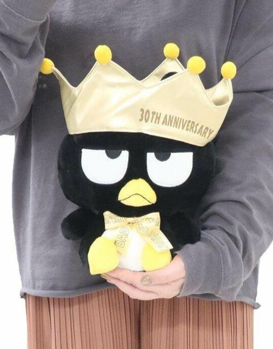 An amazing tribute to one of Sanrio's bad boys, the incomparable Bad Badtz Maru! The King Bad Badtz Maru 30th Anniversary Plushie showcases Badtz in a regal, yet cheeky look befitting his mischievous personality. He sports a well-deserved golden crown and bow tie, making him the true king of attitude.