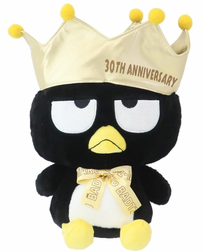 An amazing tribute to one of Sanrio's bad boys, the incomparable Bad Badtz Maru! The King Bad Badtz Maru 30th Anniversary Plushie showcases Badtz in a regal, yet cheeky look befitting his mischievous personality. He sports a well-deserved golden crown and bow tie, making him the true king of attitude.