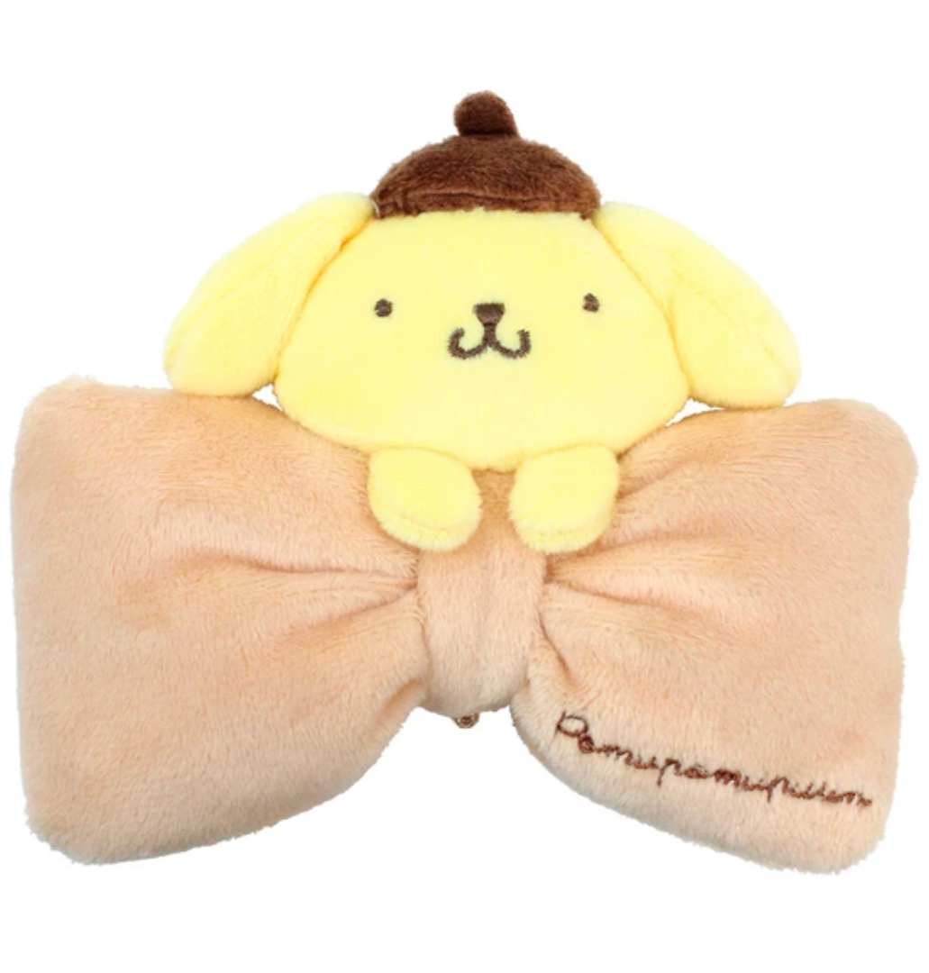 Classic Sanrio characters are featured as their adorable selves, plush style, at the center of a cutie pie bow. The embroidered character name elevates this Big Bow Pompompurin Plush Keychain